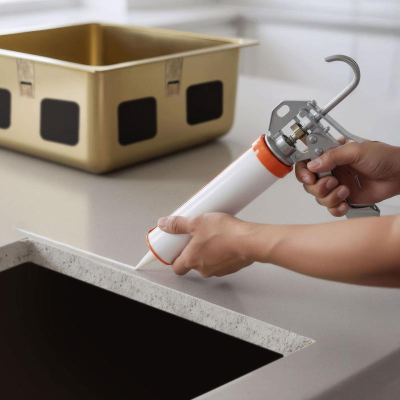 Adhésif à base de silicone sans acide pour le montage sous les éviers en inox